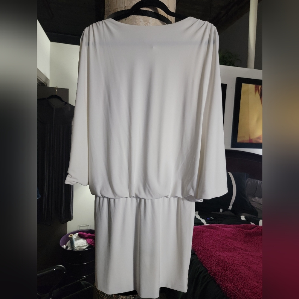 Cache White Dress with Rhinestones on the 3/4 sleeves. Length short.  This dress